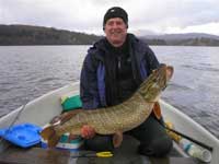 My best pike 24lb8oz Windermere with my mate Eric Feb 08
